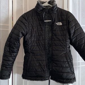 Black and fuzzy gray North Face Kids zip up